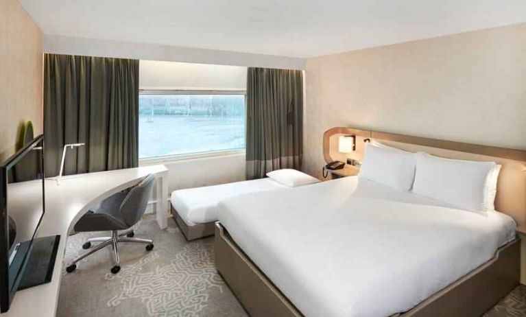 Queen room with pullout single bed at the Hilton London Heathrow Airport.