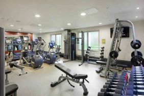 Fully equipped fitness center at the Hilton London Heathrow Airport.