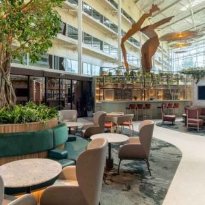 Beautiful hotel patio with plants perfect as workspace at the Hilton London Heathrow Airport.