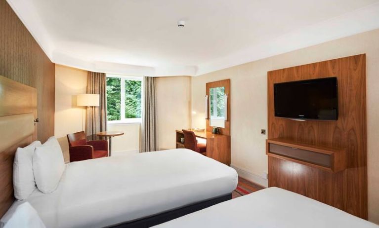 Twin room with TV screen and working station at the DoubleTree by Hilton Newbury North.