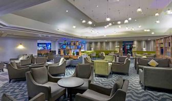 Elegant dining area with tables and chairs at the DoubleTree by Hilton Bristol North.