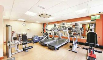 Fitness center with machines at the DoubleTree by Hilton Manchester Airport.