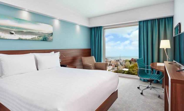 King room with sea view and desk at the Hampton by Hilton Bournemouth.