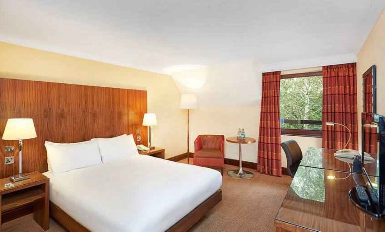 Bright king bedroom with desk at the DoubleTree by Hilton Southampton.