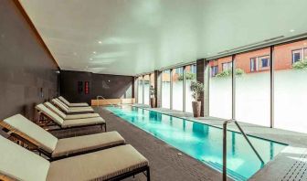 Relaxing indoor pool at the Fellows House Cambridge, Curio Collection by Hilton.