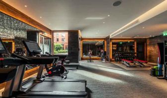 Fully equipped fitness center at the Fellows House Cambridge, Curio Collection by Hilton.