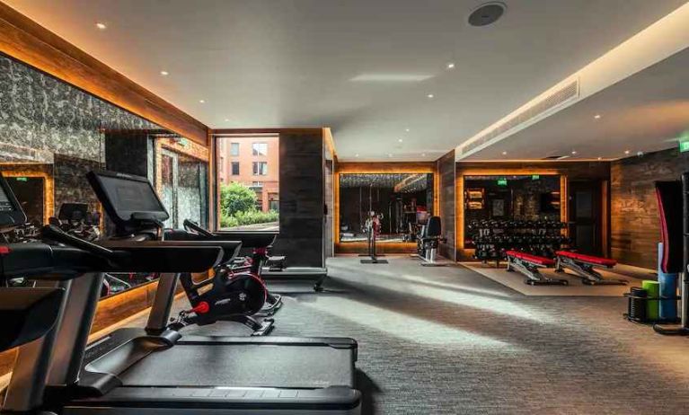 Fully equipped fitness center at the Fellows House Cambridge, Curio Collection by Hilton.