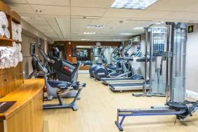 Fitness center with machines at the Hilton London Kensington.