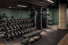 Fitness center with weights and machines at the Gantry London, Curio Collection by Hilton.