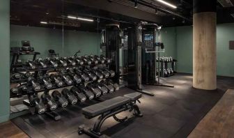 Fitness center with weights and machines at the Gantry London, Curio Collection by Hilton.