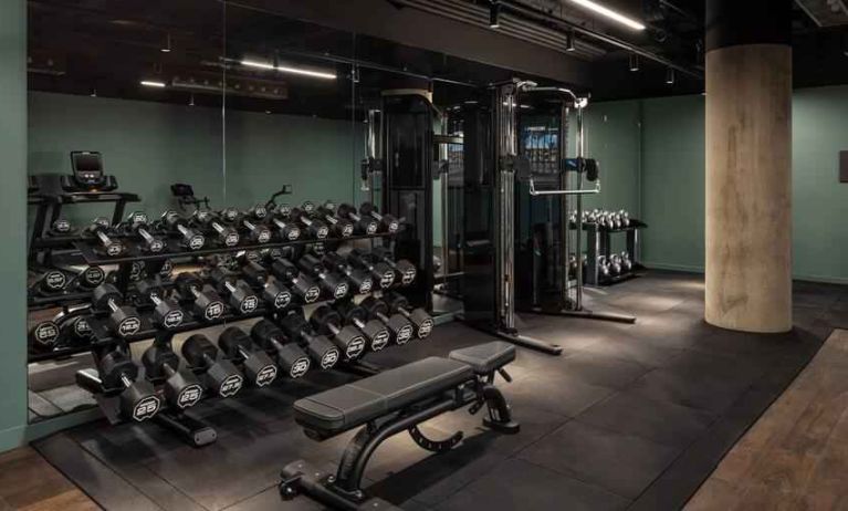 Fitness center with weights and machines at the Gantry London, Curio Collection by Hilton.