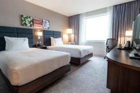 Comfortable twin room with working station at the Hilton Garden Inn Birmingham Airport UK.