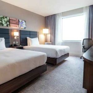 Comfortable twin room with working station at the Hilton Garden Inn Birmingham Airport UK.