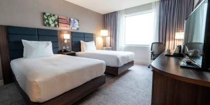 Comfortable twin room with working station at the Hilton Garden Inn Birmingham Airport UK.