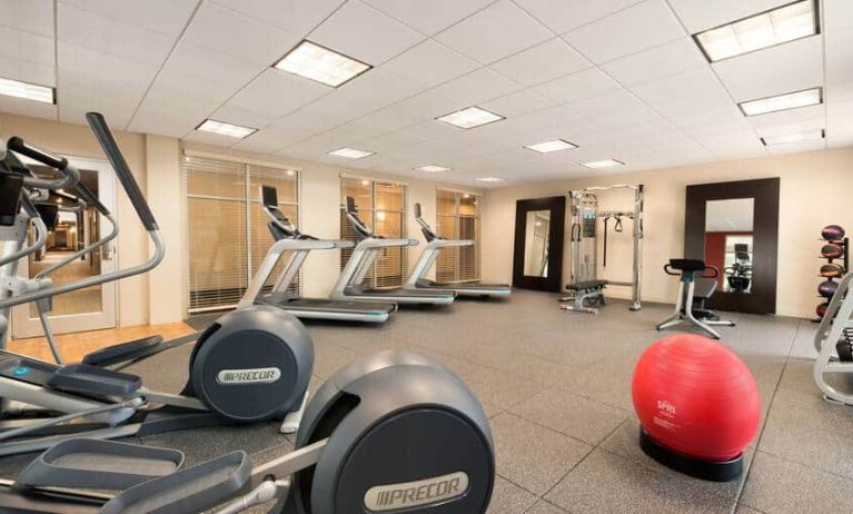 Fully equipped gym with treadmills, elipticals and weight machine at the Homewood Suite by Hilton Atlanta Perimeter.