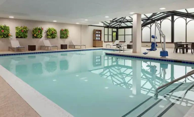 Spacious indoor pool with floral design at the Embassy Suites by Hilton Atlanta Alpharetta