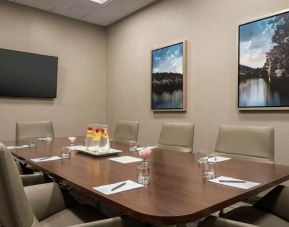 Small and quiet room for any meeting with a mounted tv at the Embassy Suite by Hilton Atlanta Alpharetta