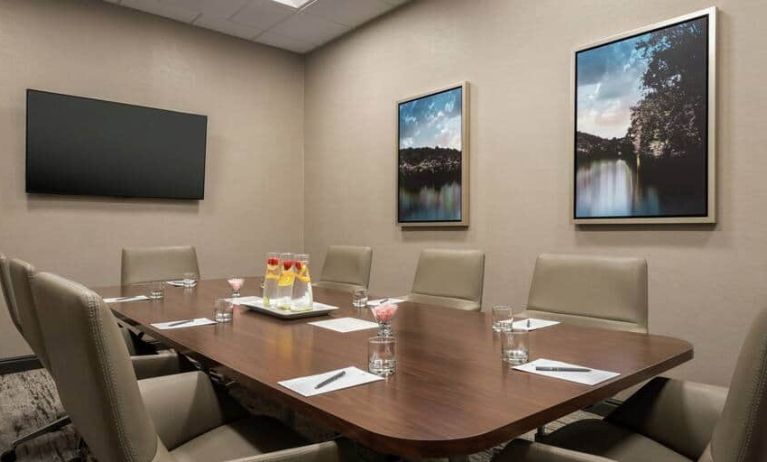 Small and quiet room for any meeting with a mounted tv at the Embassy Suite by Hilton Atlanta Alpharetta