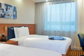 Comfortable double guest room at the Hampton by Hilton London Luton Airport.