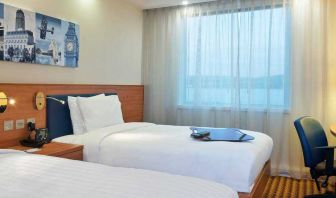 Comfortable double guest room at the Hampton by Hilton London Luton Airport.