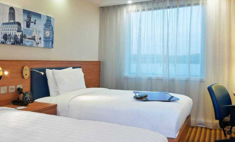 Comfortable double guest room at the Hampton by Hilton London Luton Airport.