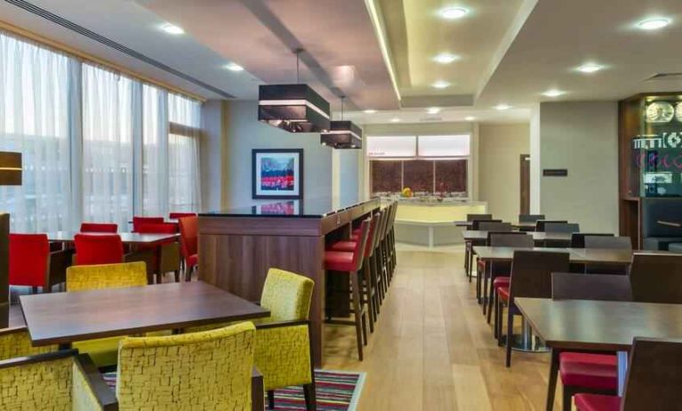 Dining area perfect for co-working at the Hampton by Hilton London Luton Airport.