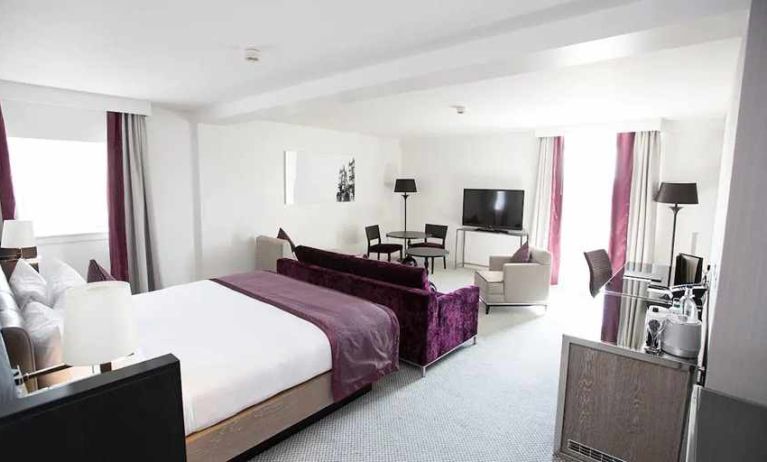 luxurious king suite with lounge area and work desk at Hilton London Angel Islington.