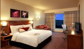 spacious king room with TV and work space at Hilton Garden Inn Luton North.