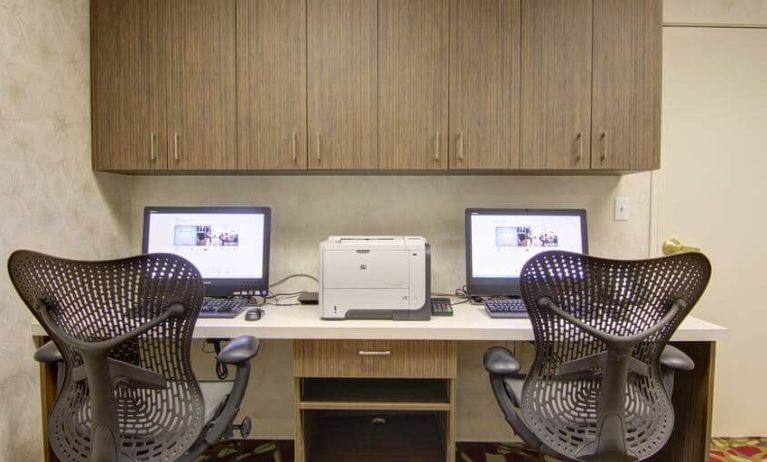 Two desktop computers with desk, printer, fax machine at Hilton Garden Inn Calgary Airport