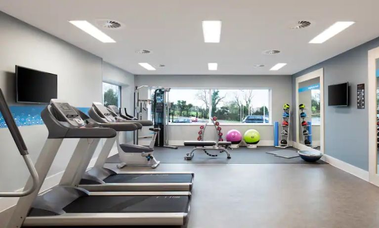 Fitness center with treadmills at the Hampton by Hilton Bristol Airport.