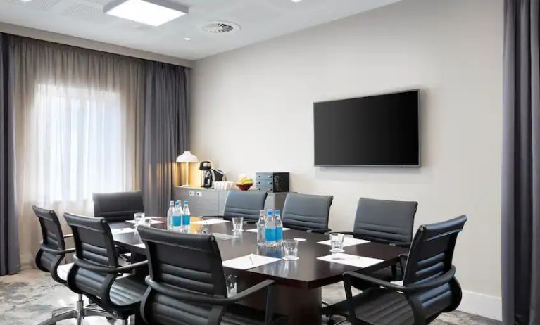 Small meeting room with TV screen at the Hampton by Hilton Bristol Airport.