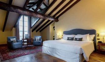 Bright and spacious king bedroom at the Grand Hotel Villa Torretta Milan Sesto, Curio Collection.