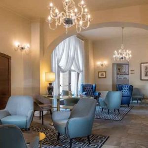 Stylish lobby workspace at the Grand Hotel Villa Torretta Milan Sesto, Curio Collection.