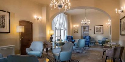 Stylish lobby workspace at the Grand Hotel Villa Torretta Milan Sesto, Curio Collection.