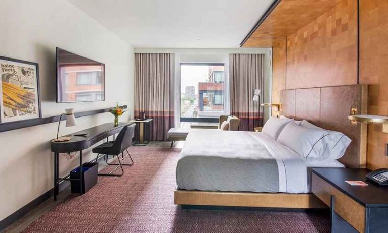 spacious king room with work desk and TV at Canopy by Hilton Jersey City Arts District.