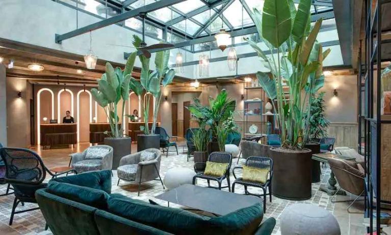 Beautiful lobby workspace with plants at the DoubleTree by Hilton Rome Monti.