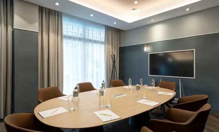 Small meeting room with round table at the DoubleTree by Hilton Rome Monti.