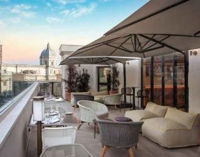 Beautiful outdoor terrace overlooking the city at the DoubleTree by Hilton Rome Monti.