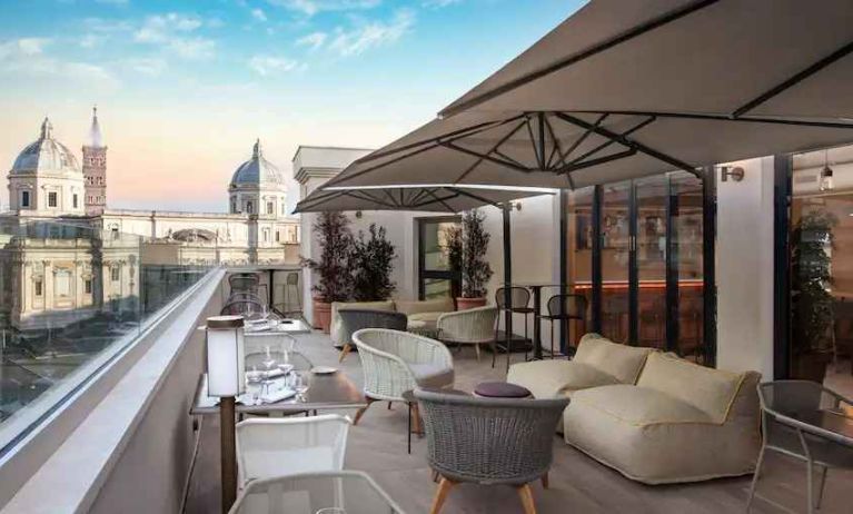 Beautiful outdoor terrace overlooking the city at the DoubleTree by Hilton Rome Monti.