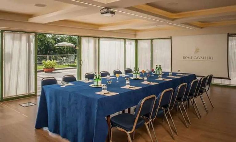 Meeting room overlooking the garden at the Rome Cavalieri, A Waldorf Astoria Hotel.