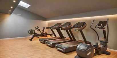 Fitness center with treadmills at the DoubleTree by Hilton Trieste.