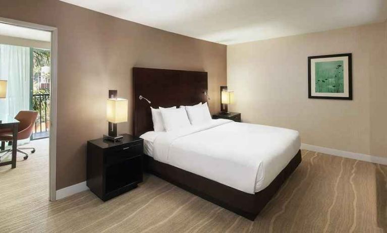 spacious king suite with dedicated work desk ideal for working remotely at DoubleTree by Hilton Hotel San Diego - Hotel Circle.