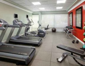 fitness center well equipped with treadmills and weights at DoubleTree by Hilton Hotel San Diego - Hotel Circle.