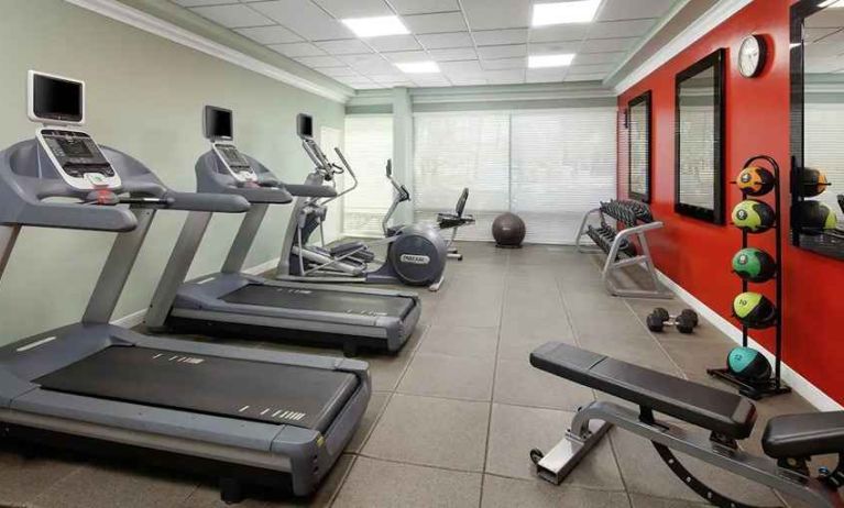 fitness center well equipped with treadmills and weights at DoubleTree by Hilton Hotel San Diego - Hotel Circle.