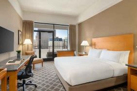 spacious king suite with work desk and city views at Hilton San Francisco Financial District.