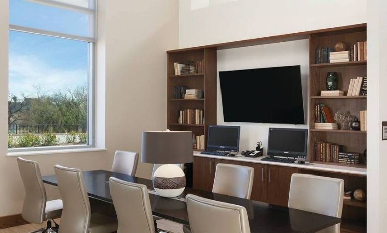 comfortable business center with work desk, PC, internet, and printer ideal for working remotely and for coworking at Embassy Suites by Hilton Oklahoma City Downtown Medical Center.