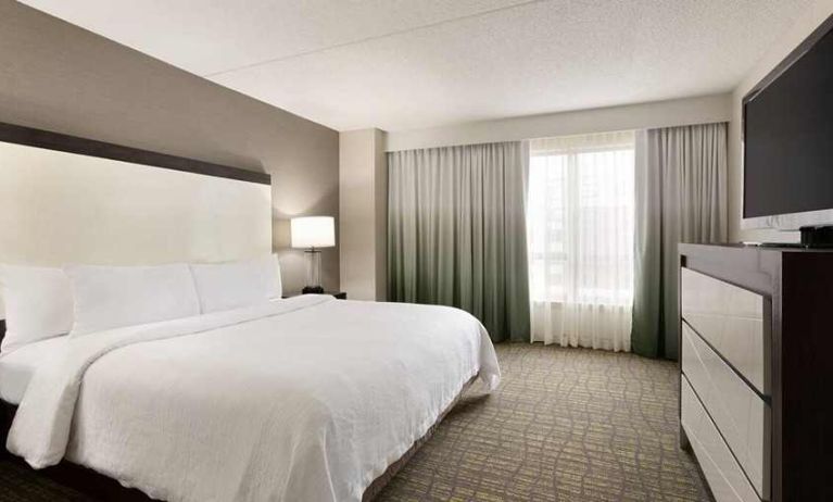 spacious king suite with TV at Embassy Suites by Hilton Newark Wilmington South.