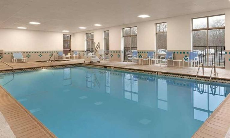 lovely indoor pool with surround seating area at Embassy Suites by Hilton Newark Wilmington South.