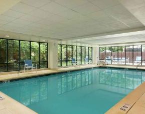 lovely indoor pool with seating area at Homewood Suites by Hilton Newark-Wilmington South Area.
