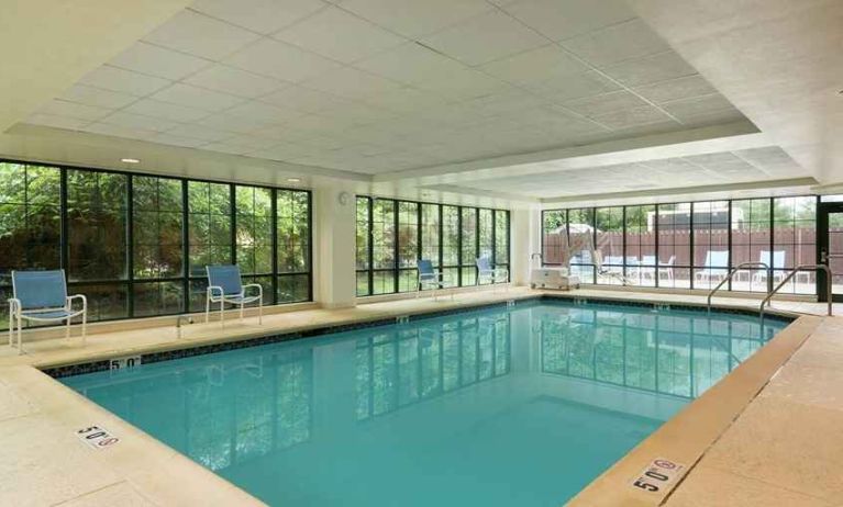 lovely indoor pool with seating area at Homewood Suites by Hilton Newark-Wilmington South Area.